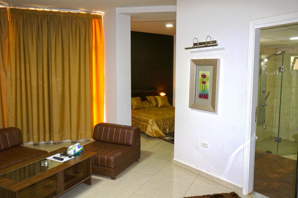 A Matador Hotel suite with a private sitting area and bedroom