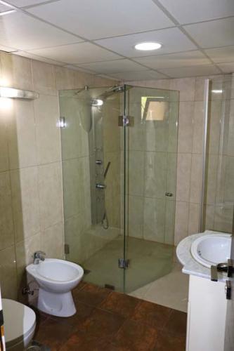 Bathroom with walk-in glass shower