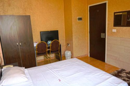 Room with seating area and dining table